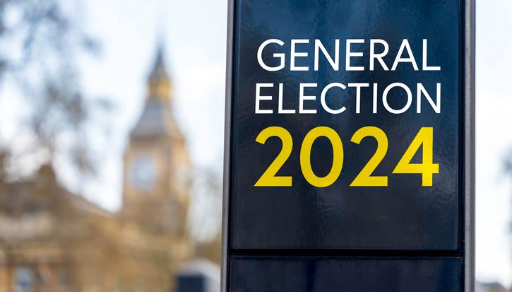 A sign reads, 'general election 2024', with the Elizabeth Tower visible in the background